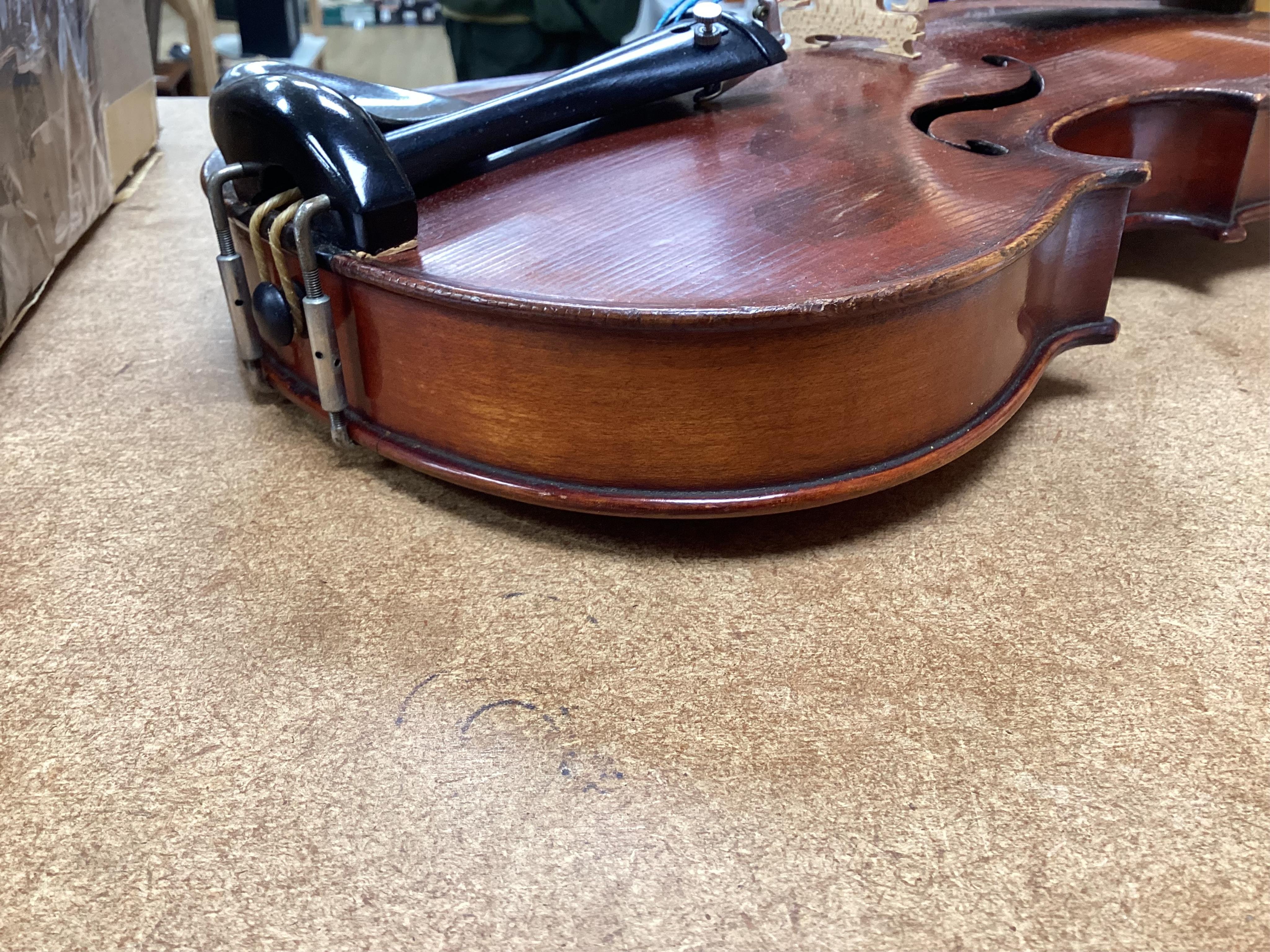 A cased late 19th century German Mittenwald violin with lion’s head scroll, and two bows, Ivory submission ref: RP2E5HT1
